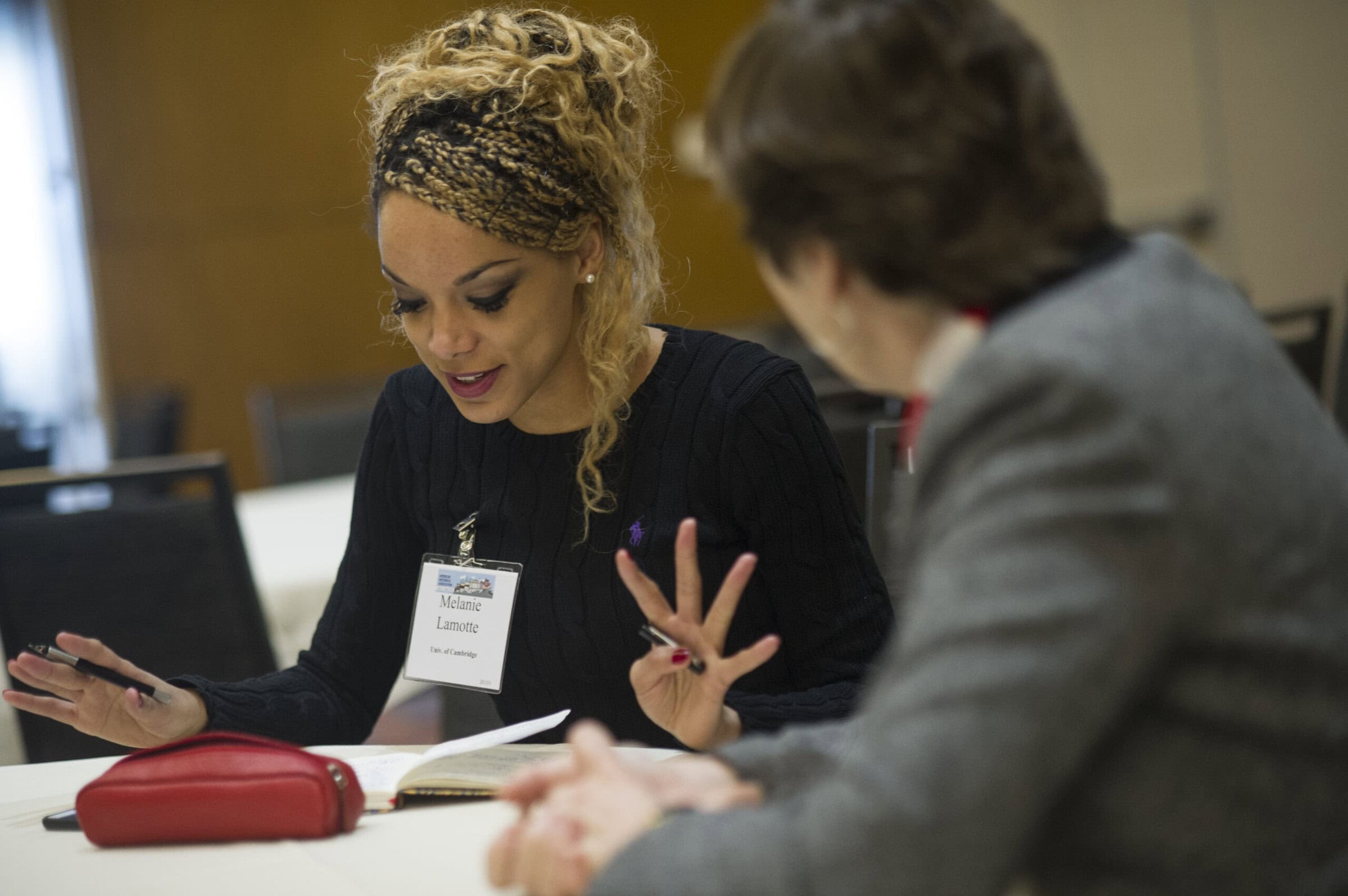 Woman looking at a paper doing workshop with group