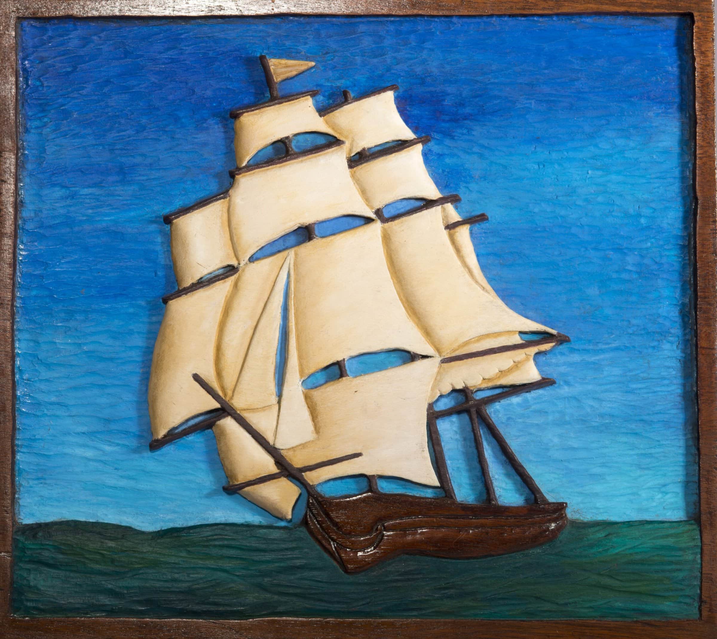 Painted wood carving of tall ship